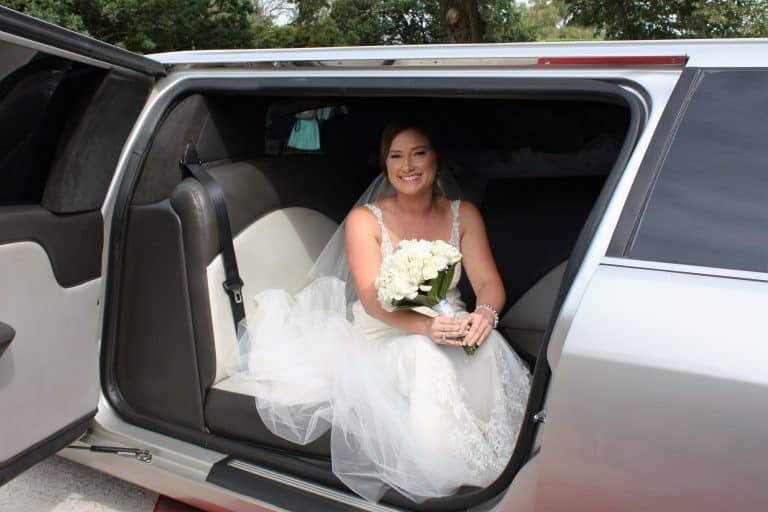 bride with the wedding limo